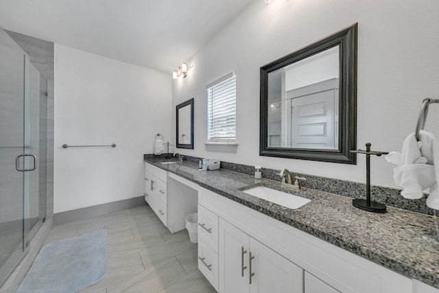 bathroom with vanity, tile patterned floors, and an enclosed shower