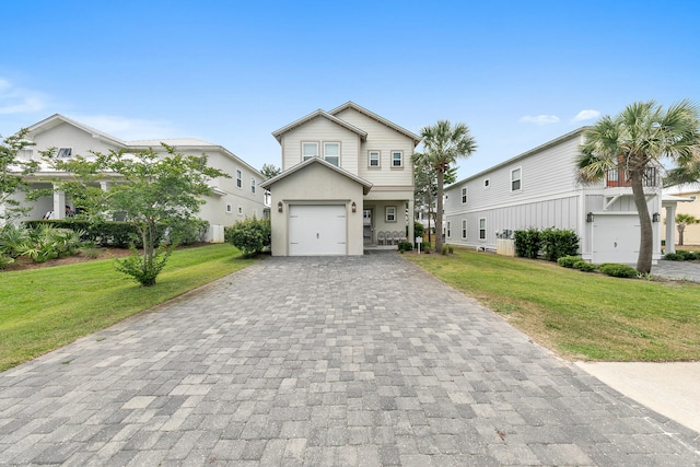 view of front of house with a front yard and a garage