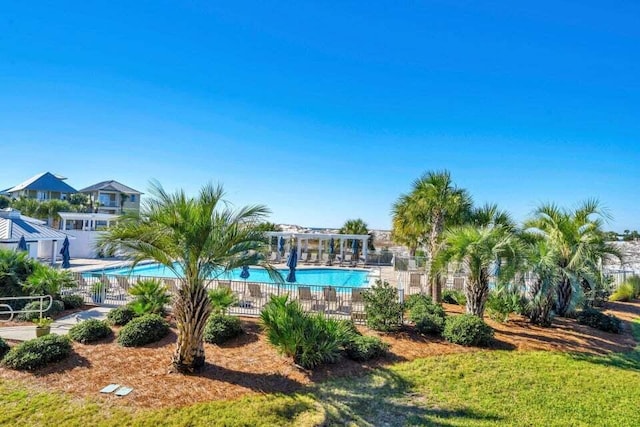 view of pool featuring a yard