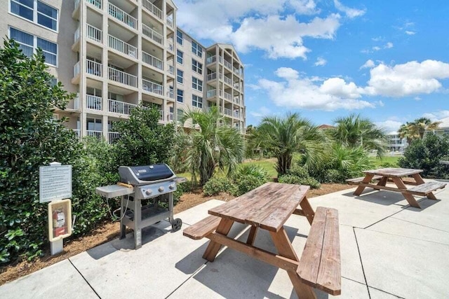 view of property's community featuring a patio area