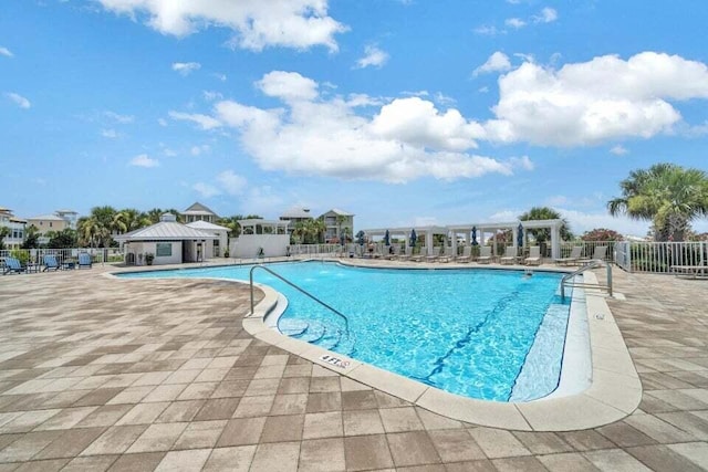 view of swimming pool with a pergola and a patio area