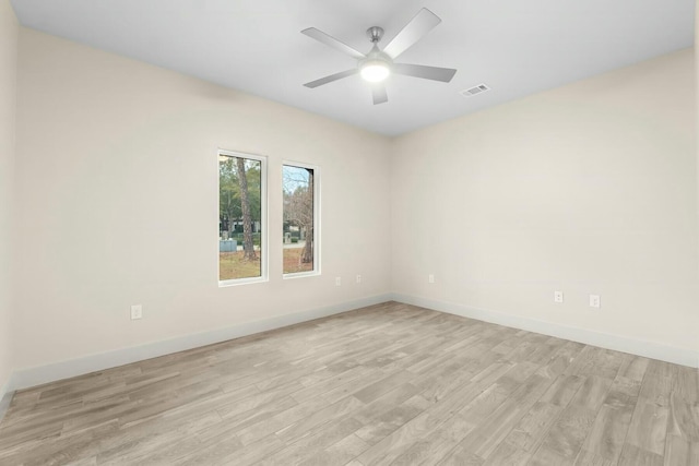 spare room featuring ceiling fan and light wood-type flooring