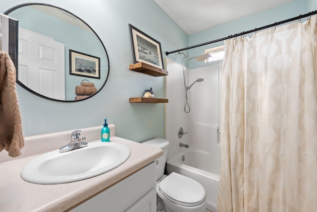 full bathroom featuring toilet, a textured ceiling, shower / tub combo, and vanity