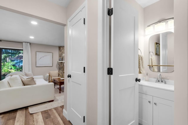 bathroom featuring vanity and hardwood / wood-style floors