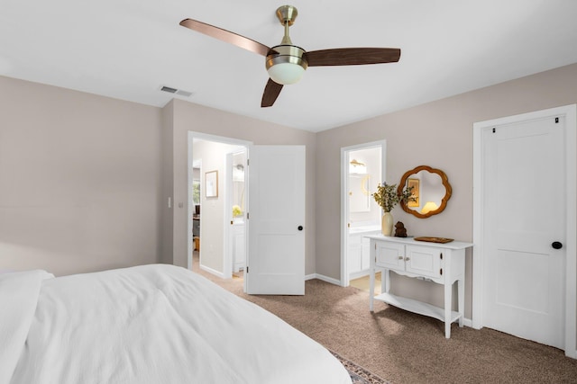 bedroom with ceiling fan, connected bathroom, and light carpet