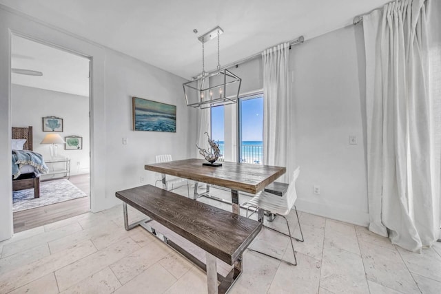 dining space featuring a water view