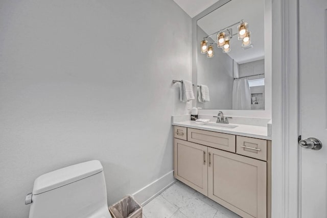 bathroom featuring vanity and toilet