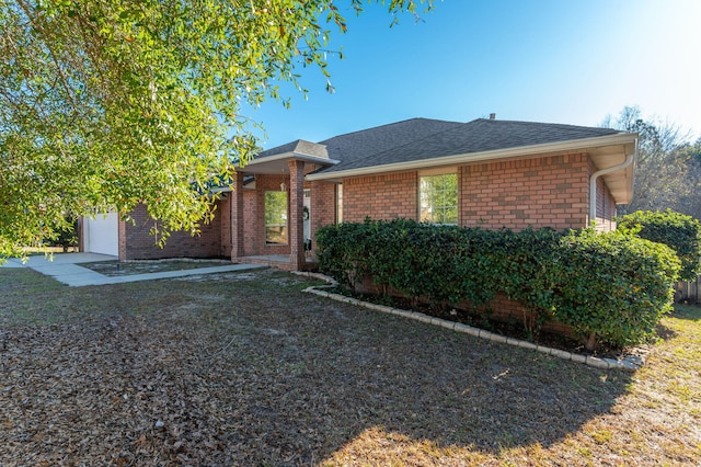 ranch-style house with a front lawn