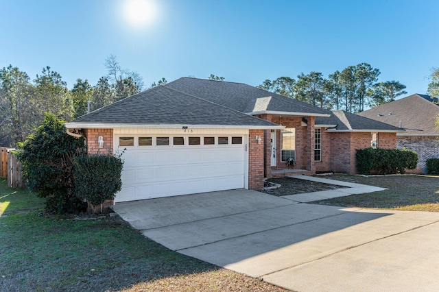 view of front facade with a front yard and a garage