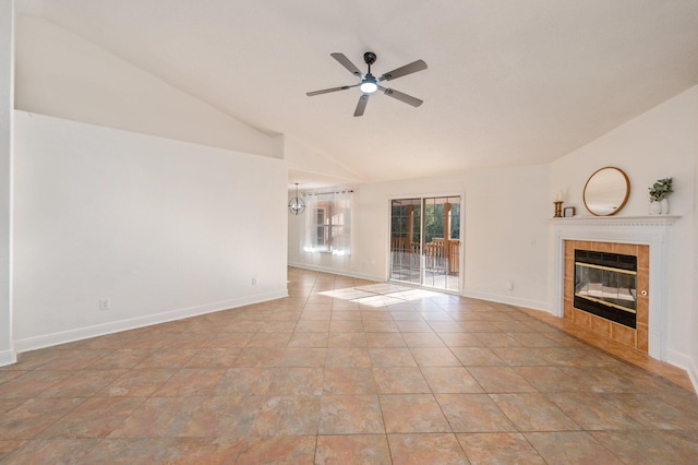 unfurnished living room featuring ceiling fan, a fireplace, and vaulted ceiling