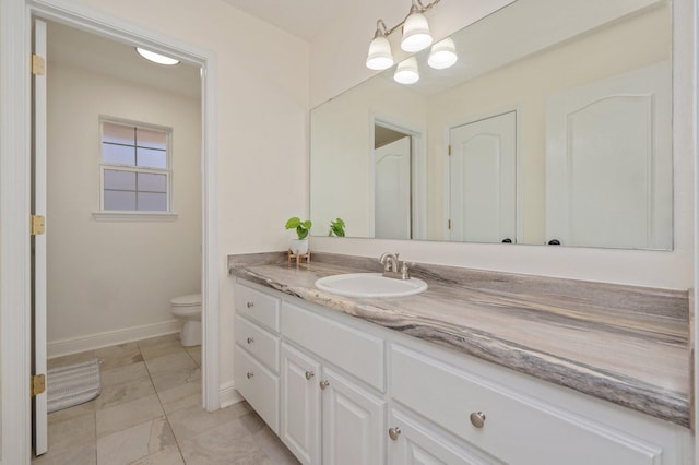 bathroom with vanity and toilet