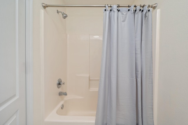 bathroom with shower / tub combo with curtain