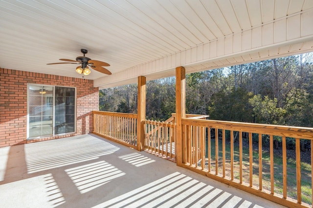 wooden terrace featuring ceiling fan