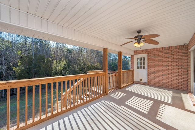 wooden terrace featuring ceiling fan