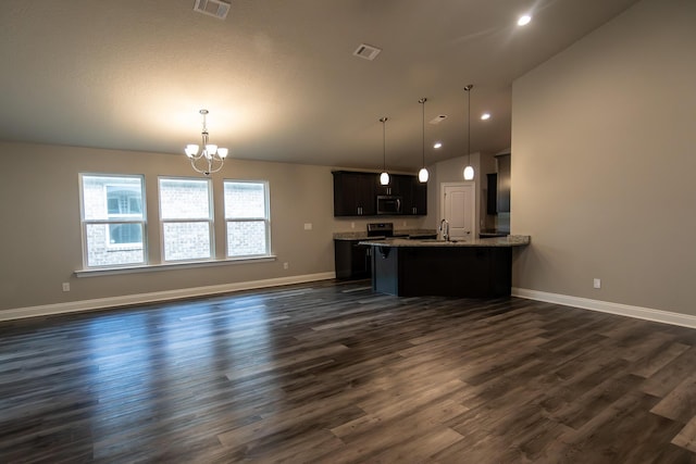 kitchen with hanging light fixtures, electric range oven, dark hardwood / wood-style floors, and kitchen peninsula