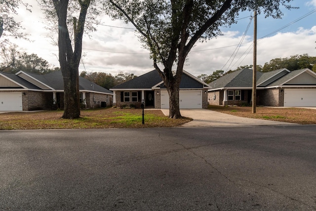 ranch-style house featuring a garage and a front lawn