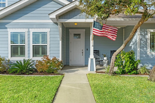 property entrance with a yard