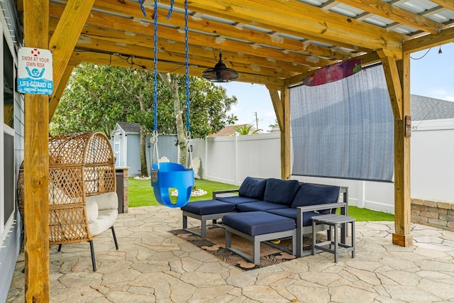 view of patio / terrace with ceiling fan, a pergola, a storage unit, and an outdoor living space