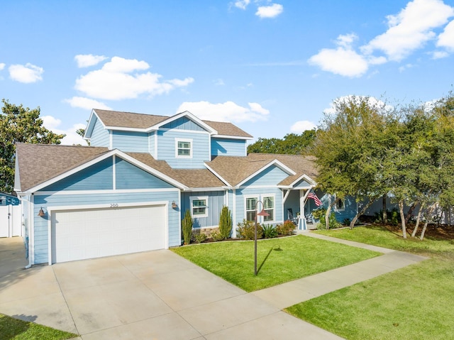 view of front of home featuring a garage and a front yard