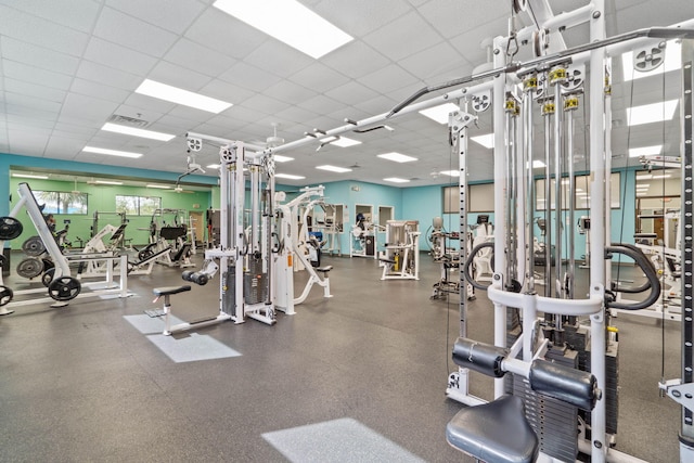 workout area featuring a drop ceiling