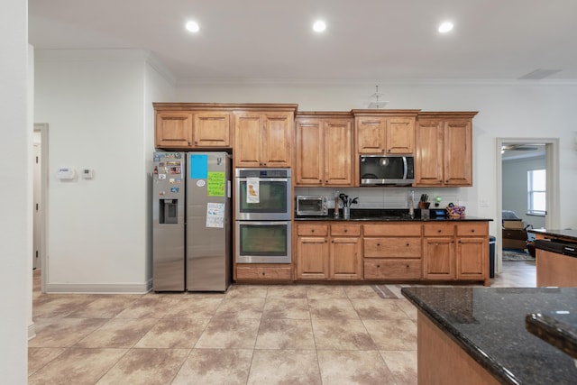 kitchen featuring brown cabinets, stainless steel appliances, crown molding, a toaster, and decorative backsplash