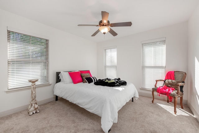 bedroom featuring carpet flooring, baseboards, and ceiling fan