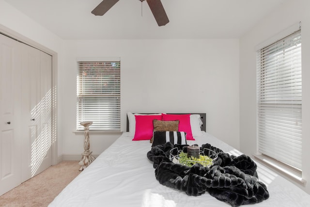 bedroom with carpet flooring, a ceiling fan, and a closet