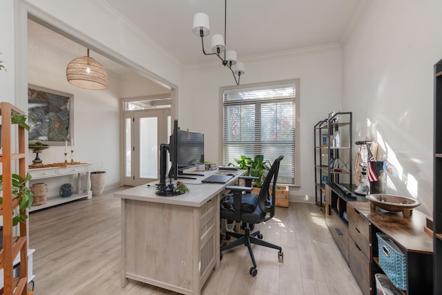 office space with baseboards, light wood-style floors, and crown molding