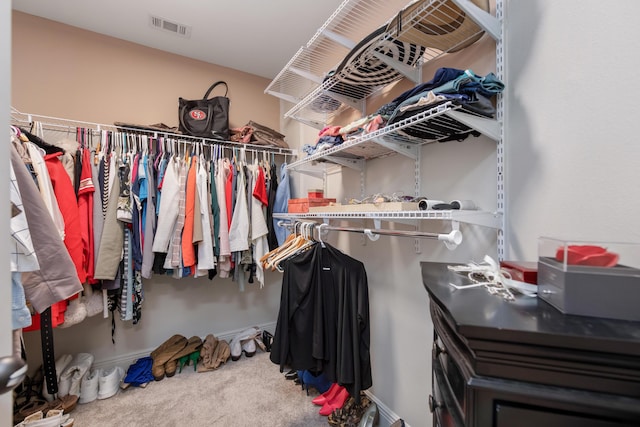 spacious closet with carpet and visible vents