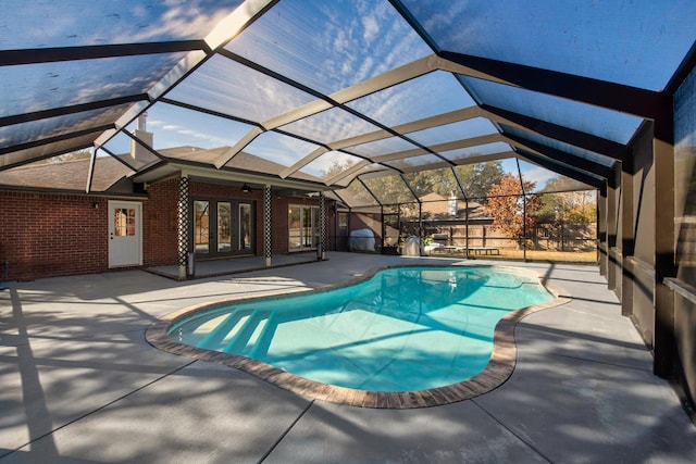 pool featuring ceiling fan, french doors, a patio, and a lanai