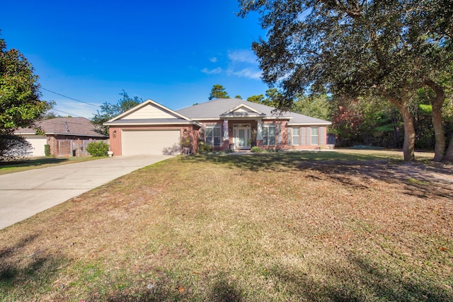 single story home with brick siding, a front lawn, an attached garage, and driveway