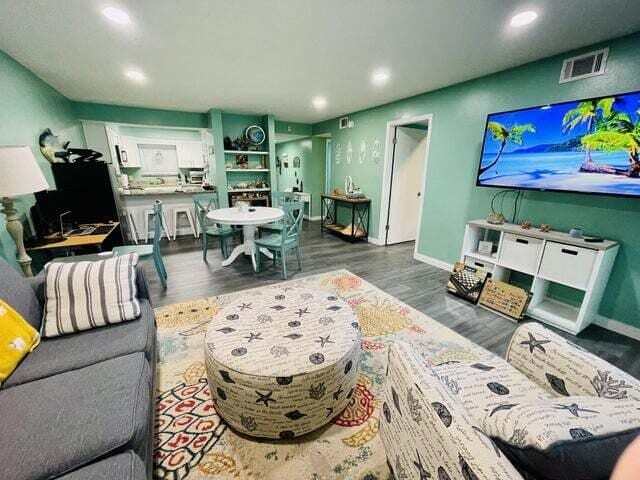 living room with dark wood-type flooring