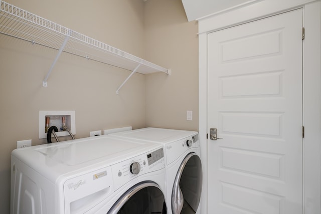 laundry room with washer and dryer