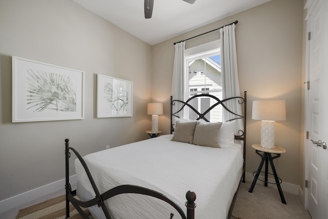 carpeted bedroom with ceiling fan and lofted ceiling