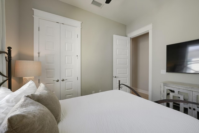 bedroom featuring ceiling fan and a closet