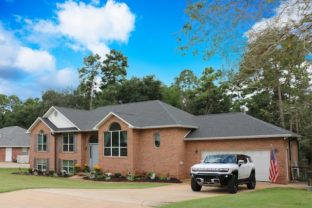 view of front facade featuring a garage and a front lawn