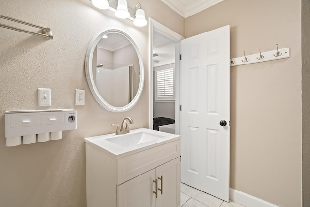 bathroom with vanity, ornamental molding, and walk in shower