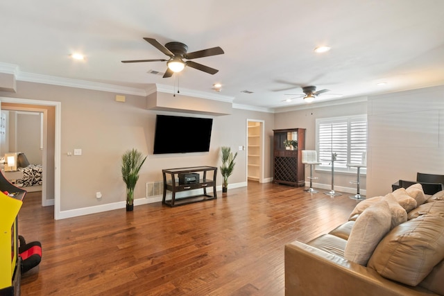 living room featuring crown molding, ceiling fan, and hardwood / wood-style flooring