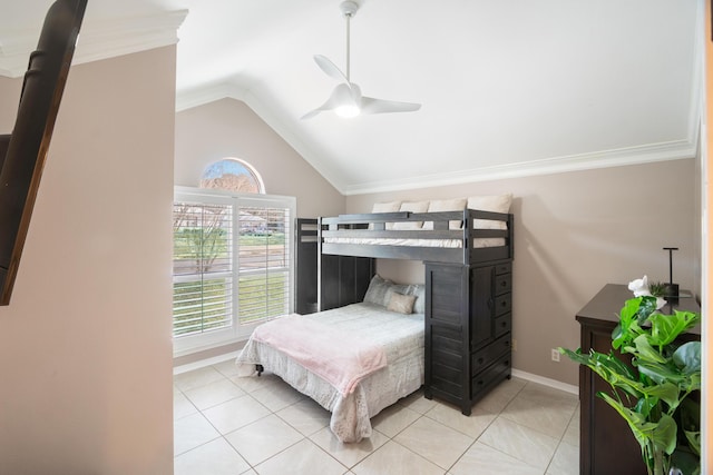 tiled bedroom with ornamental molding, vaulted ceiling, and ceiling fan