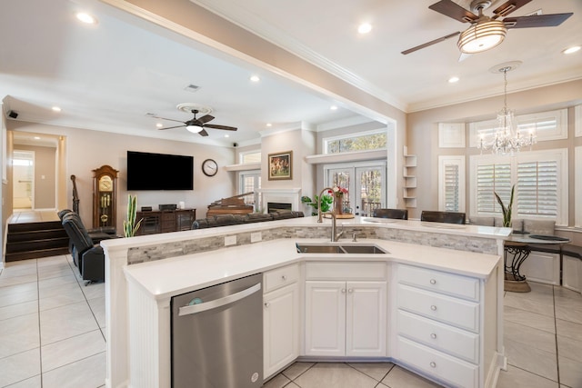 kitchen featuring sink, white cabinets, ornamental molding, stainless steel dishwasher, and ceiling fan