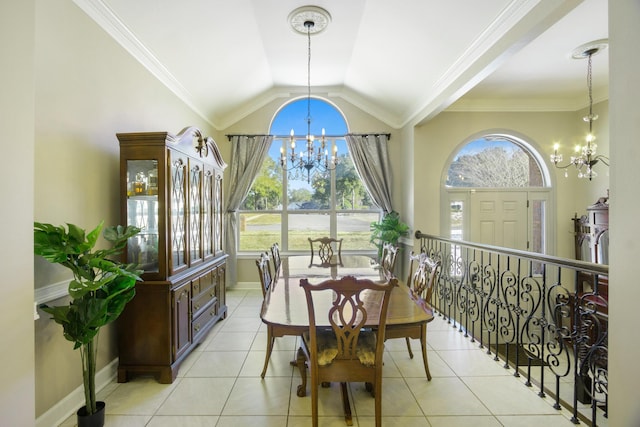 tiled dining space with vaulted ceiling, ornamental molding, and an inviting chandelier