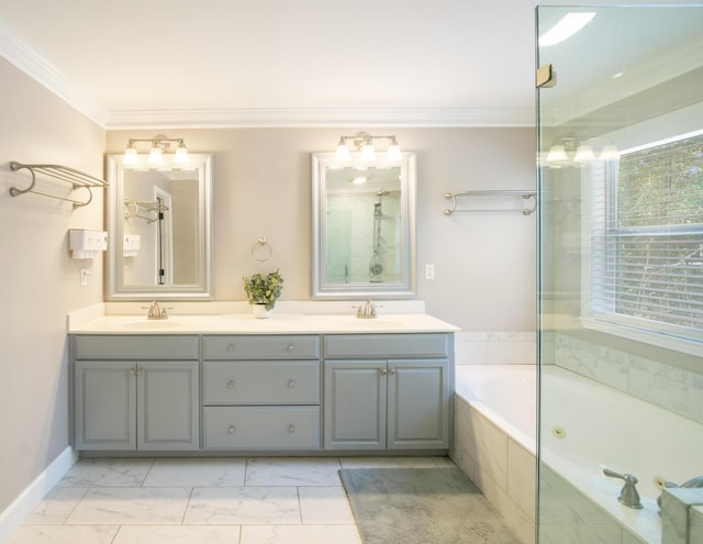 bathroom with crown molding, vanity, and tiled bath