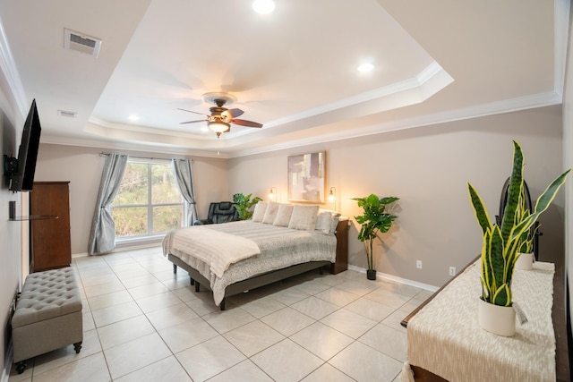 bedroom featuring a raised ceiling, ornamental molding, light tile patterned floors, and ceiling fan