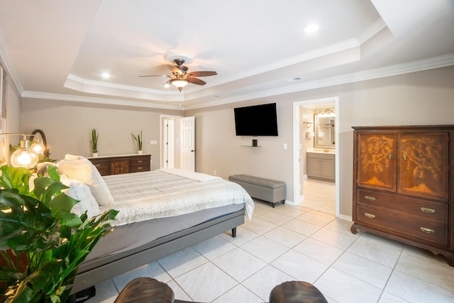 tiled bedroom featuring crown molding, ceiling fan, ensuite bathroom, and a raised ceiling