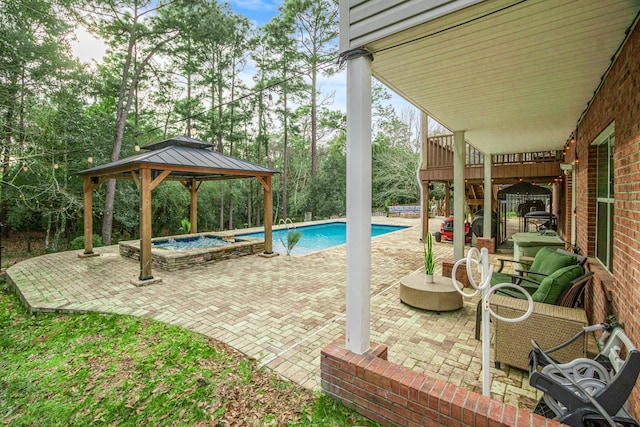 view of swimming pool featuring a gazebo, an outdoor living space, an in ground hot tub, and a patio