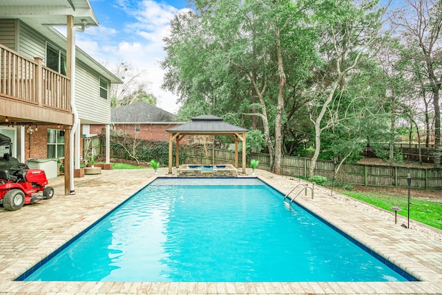 view of swimming pool with a gazebo and a patio area