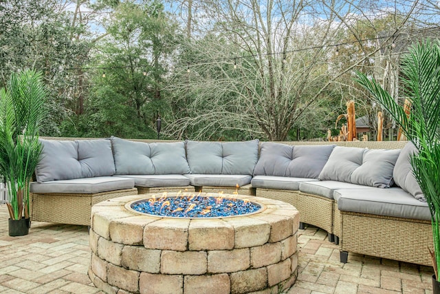 view of patio / terrace featuring an outdoor living space with a fire pit