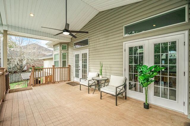 wooden terrace featuring french doors and ceiling fan