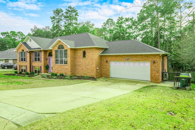 view of front of home with a garage and a front yard