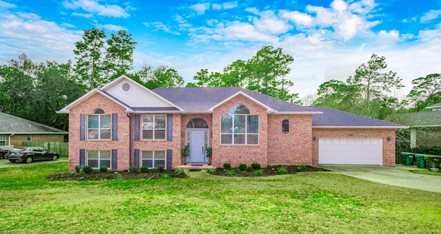 view of front facade with a garage and a front yard